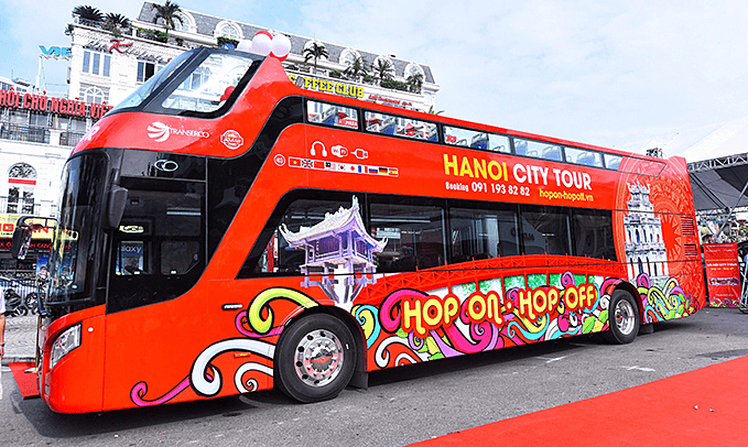 Take a double-decker bus to explore the streets of Hanoi