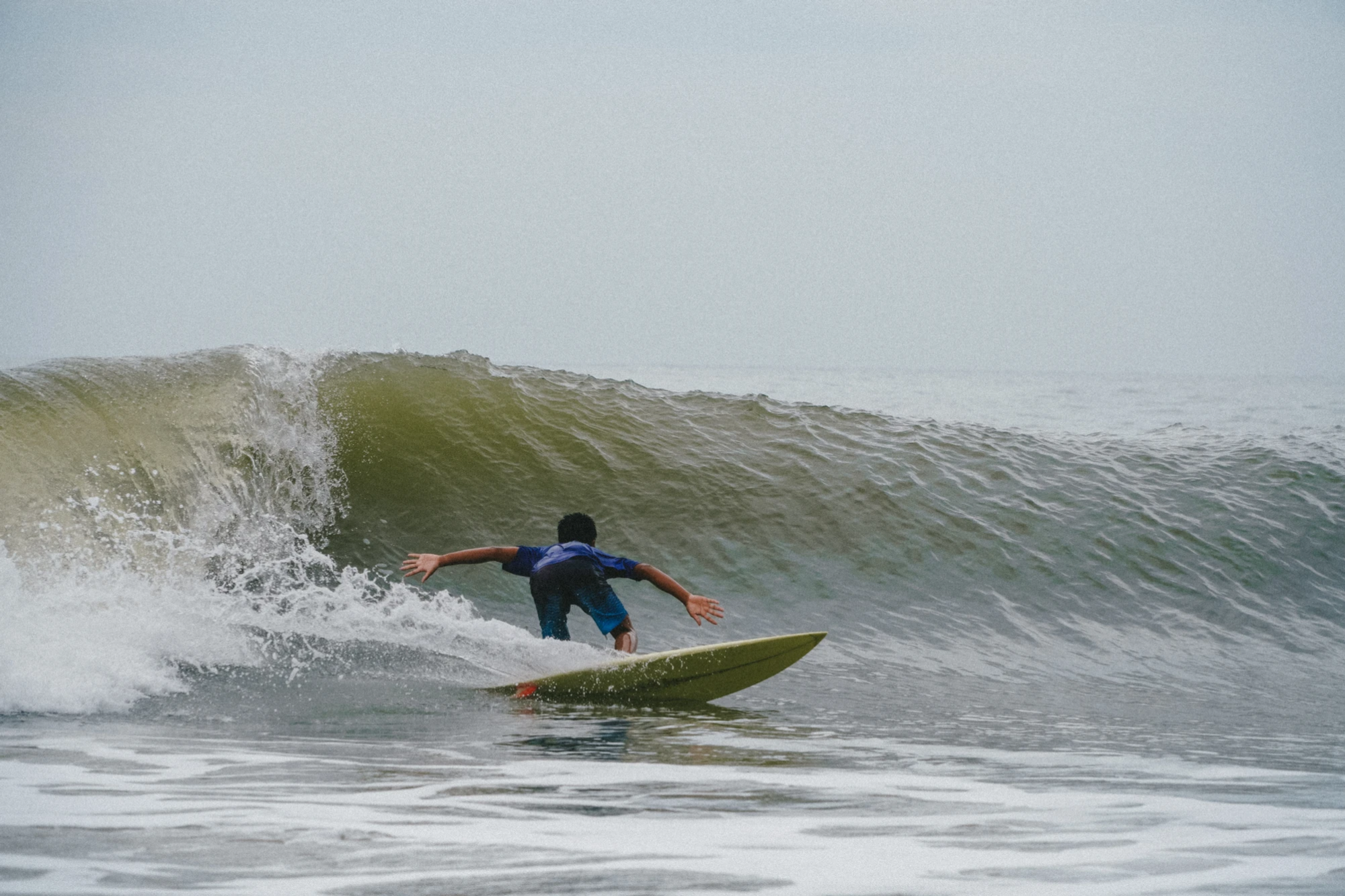 Surfing at Little Buddha Beach - popular spot for intermediate surfers