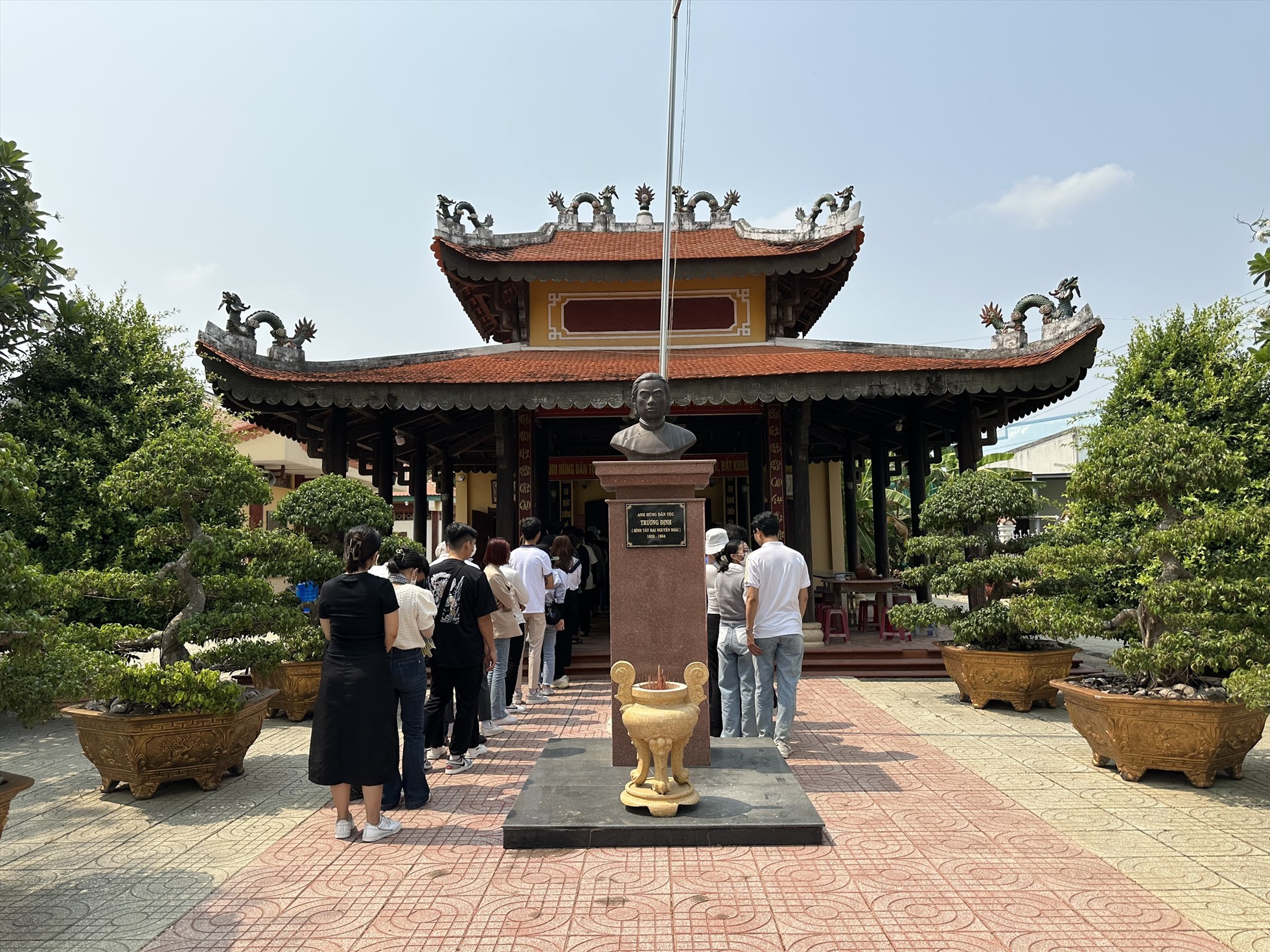 Tourists pay tribute at the Truong Dinh Temple